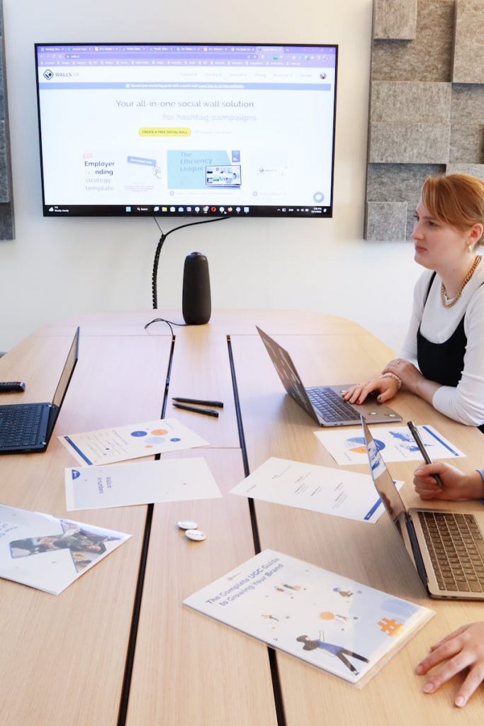 Women discussing business strategy in a modern office during a team meeting.